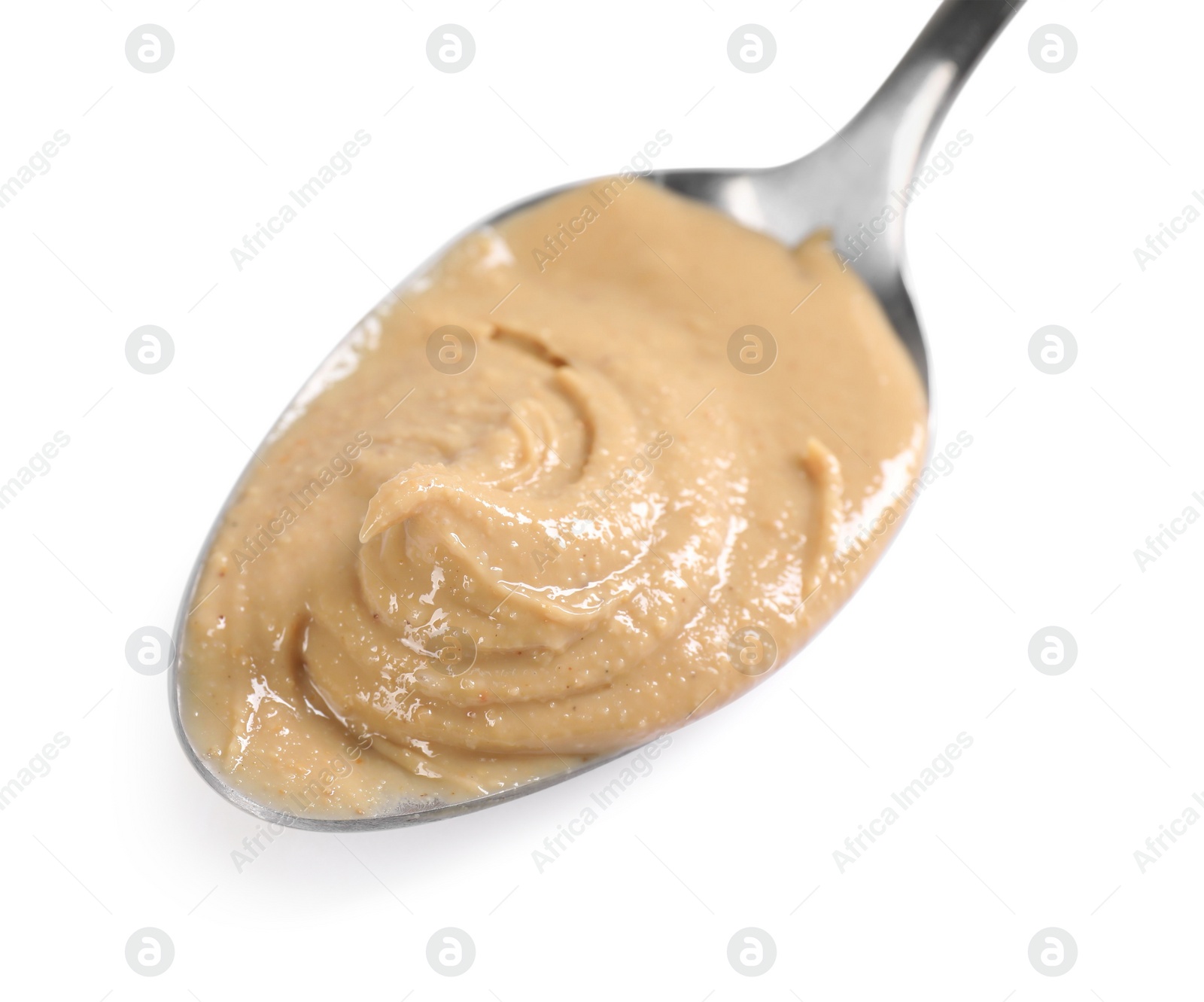 Photo of Delicious nut butter in spoon isolated on white