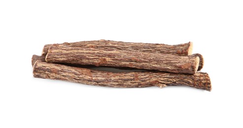 Dried sticks of liquorice root on white background