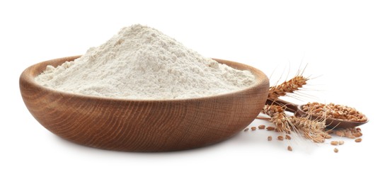 Photo of Flour in bowl, spikelets and spoon with grains on white background