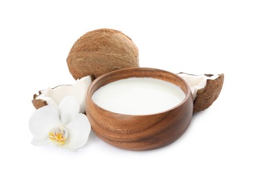Photo of Wooden bowl of delicious coconut milk, orchid flower and coconuts isolated on white