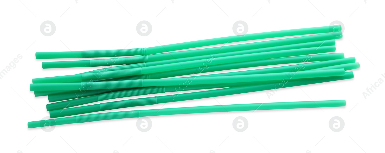 Photo of Green plastic cocktail straws on white background, top view