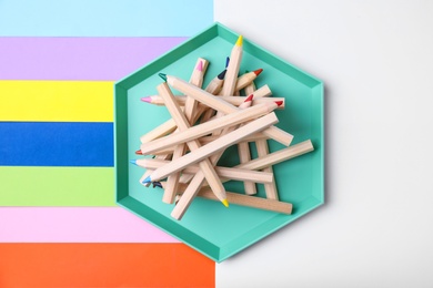 Photo of Flat lay composition with pencils on color background