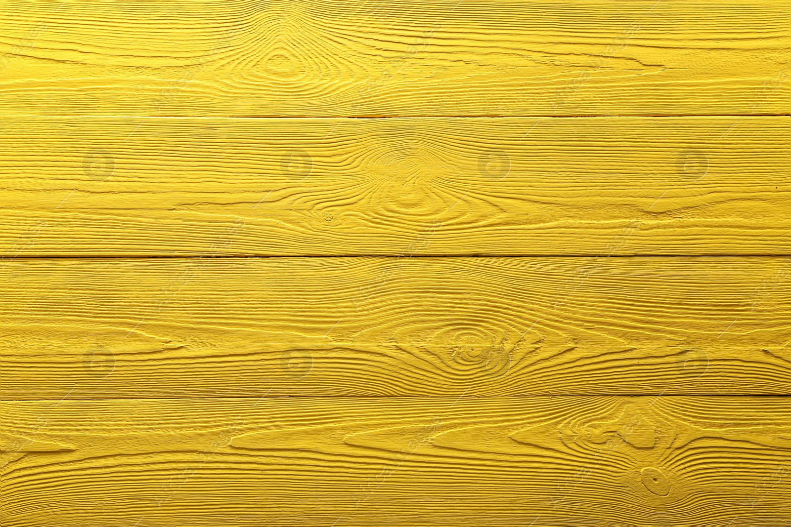 Photo of Texture of yellow wooden surface as background, top view