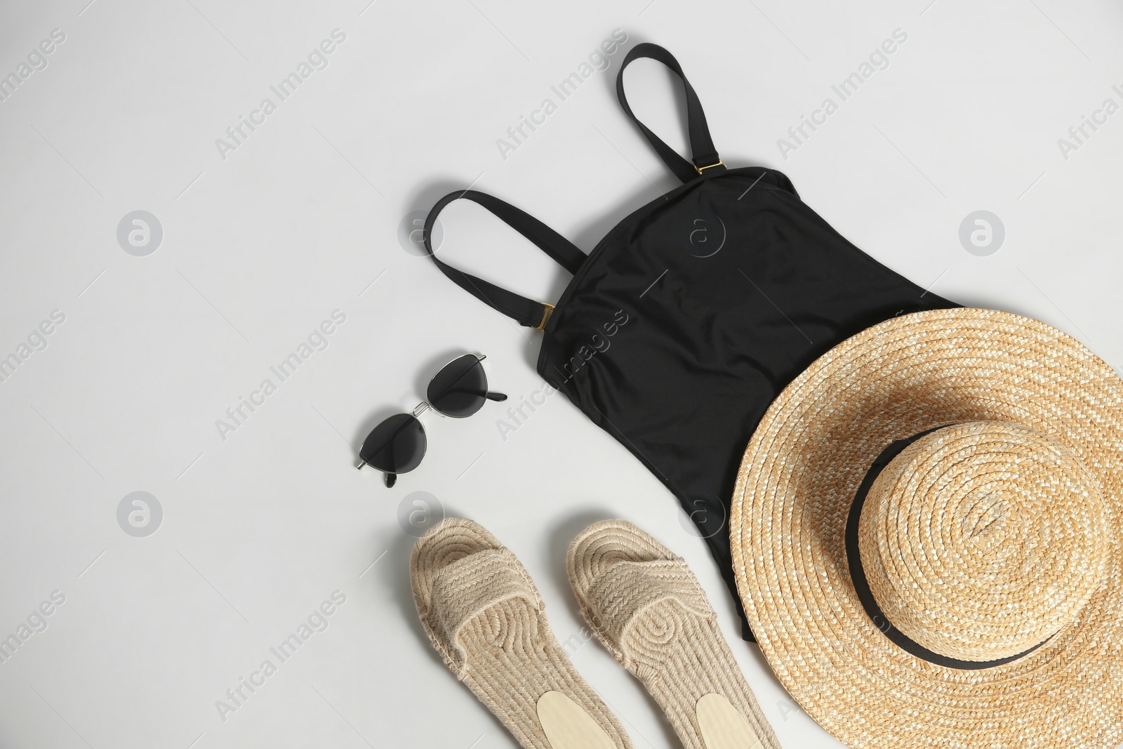 Photo of Composition with stylish beach accessories on white background, top view