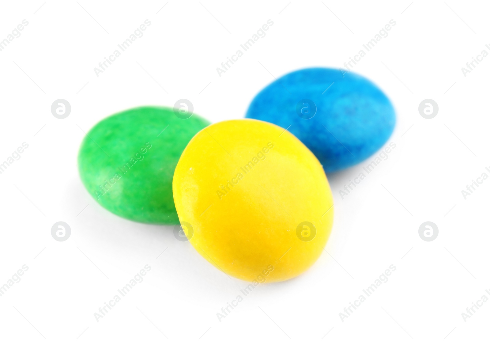 Photo of Small colorful chocolate candies on white background