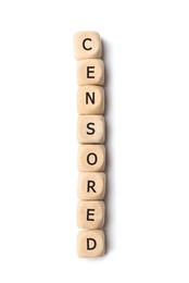 Wooden cubes with word Censored on white background, top view