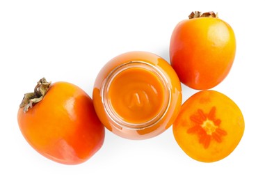 Photo of Delicious persimmon jam and fresh fruits isolated on white, top view