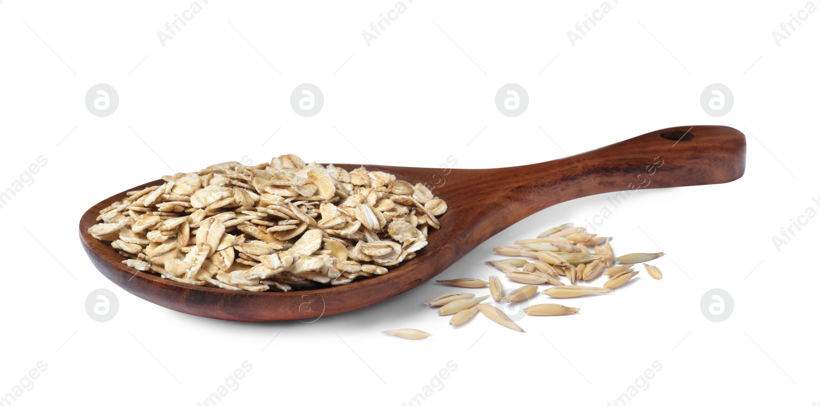 Photo of Raw oatmeal and wooden spoon on white background