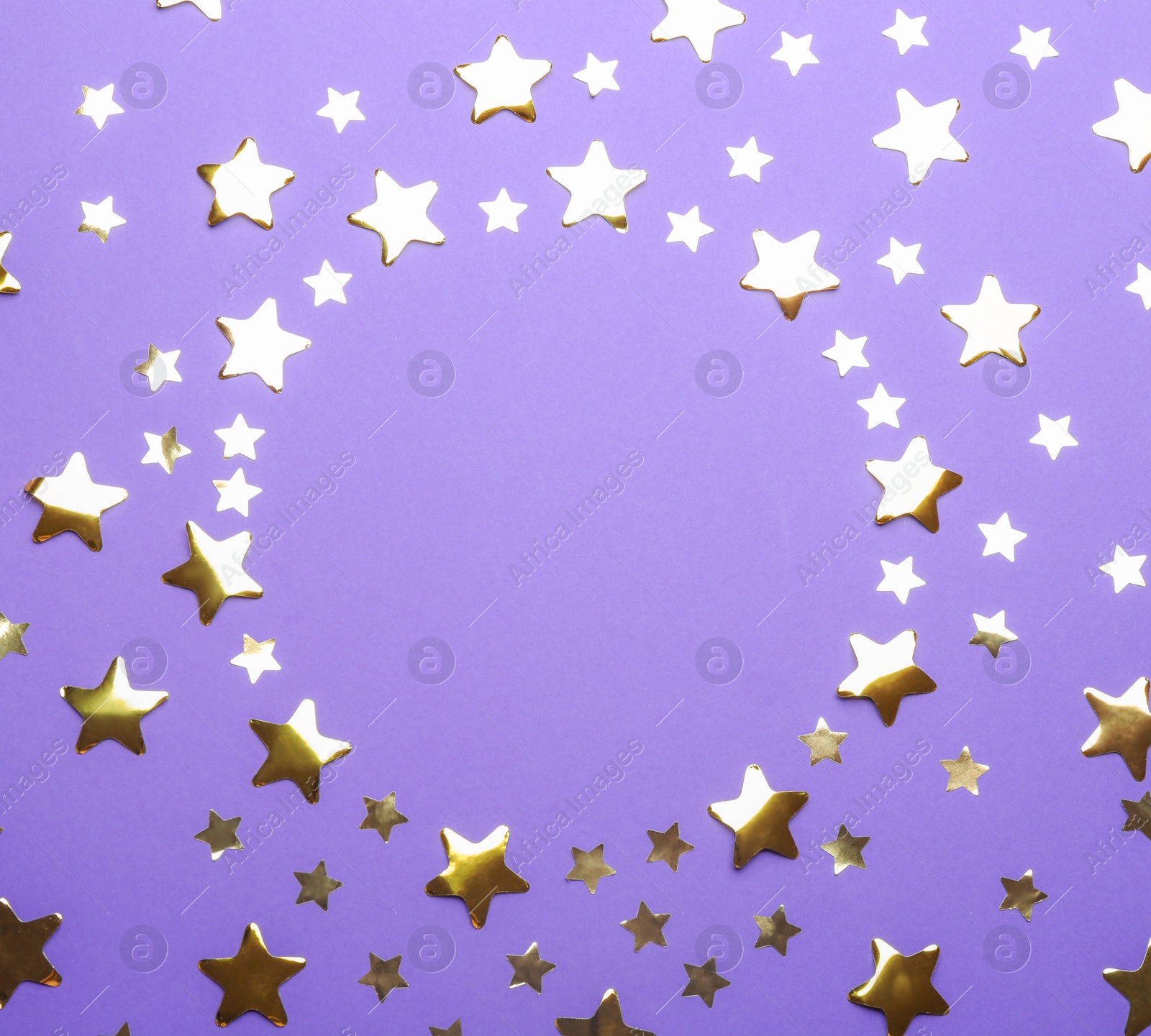 Photo of Frame made of confetti stars with space for text on violet background, top view. Christmas celebration