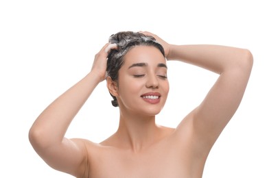 Photo of Beautiful happy woman washing hair on white background