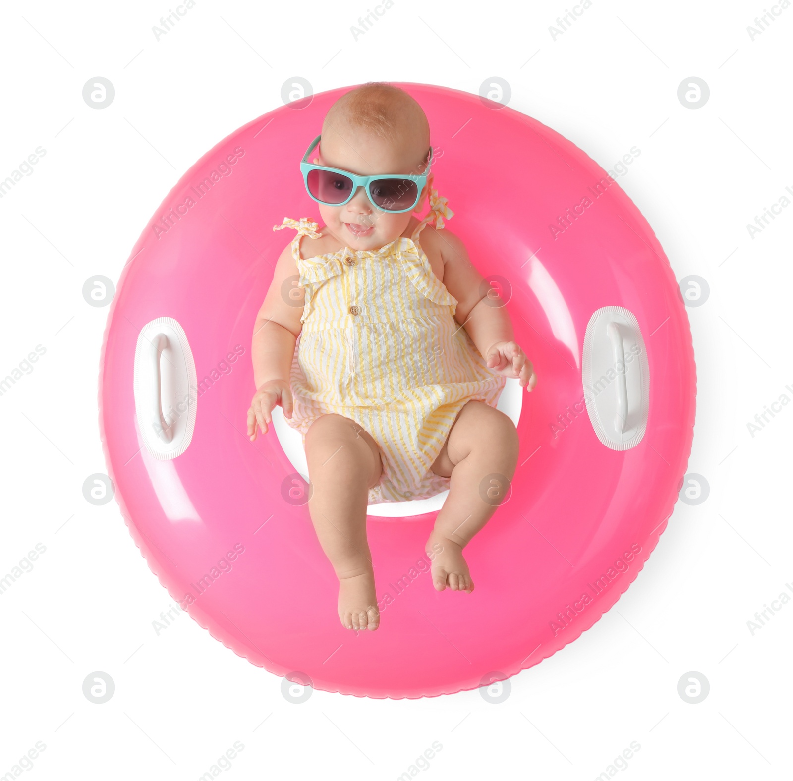 Photo of Cute little baby in sunglasses with inflatable ring on white background, top view