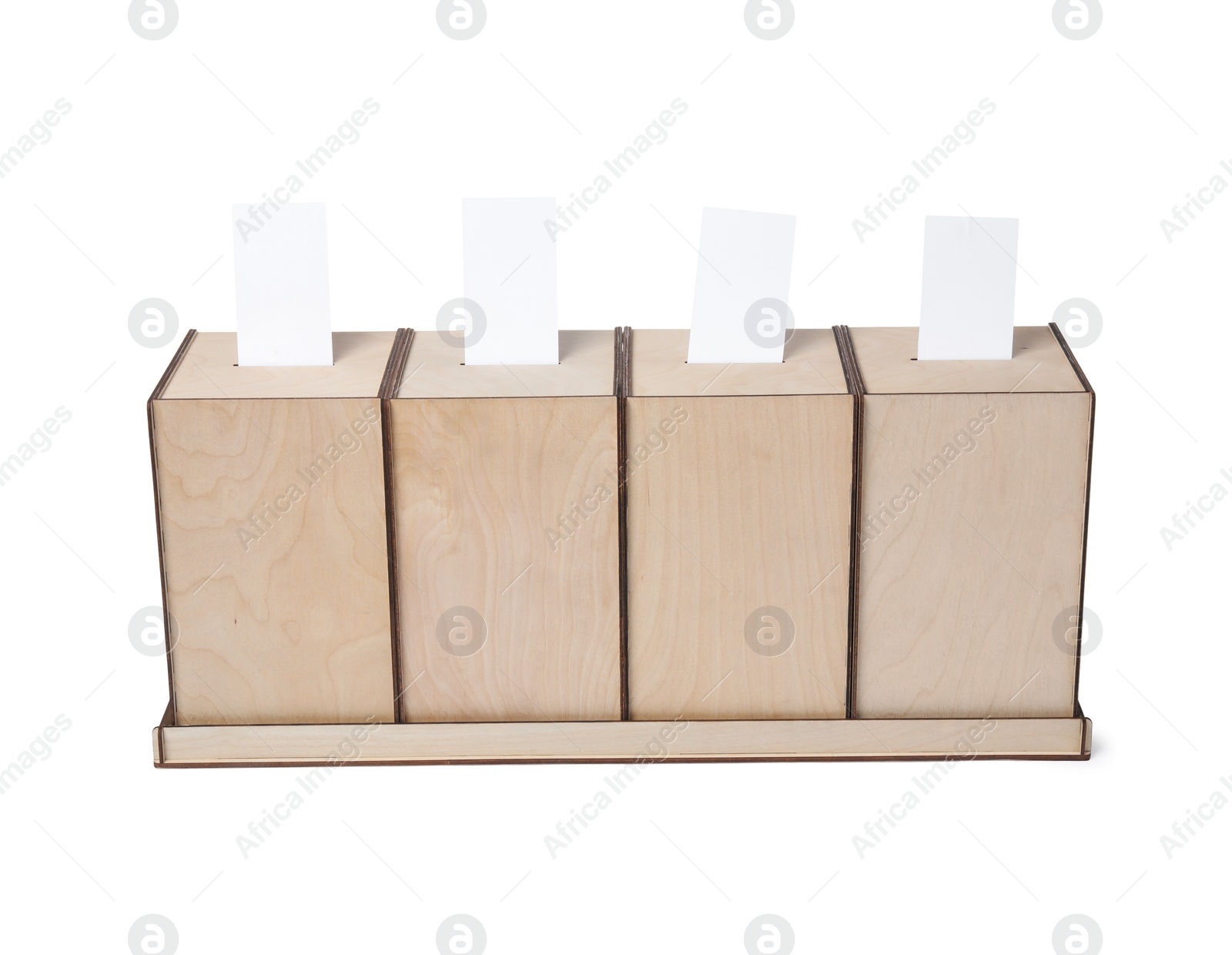 Photo of Wooden ballot boxes with votes isolated on white