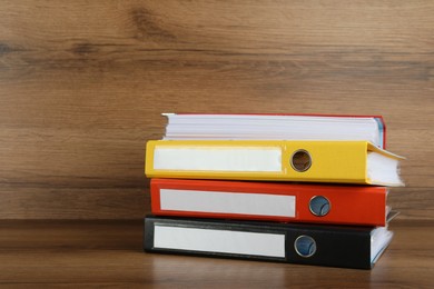 Stack of office folders on wooden table