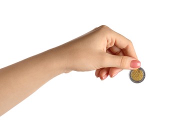 Woman holding one coin against white background, closeup