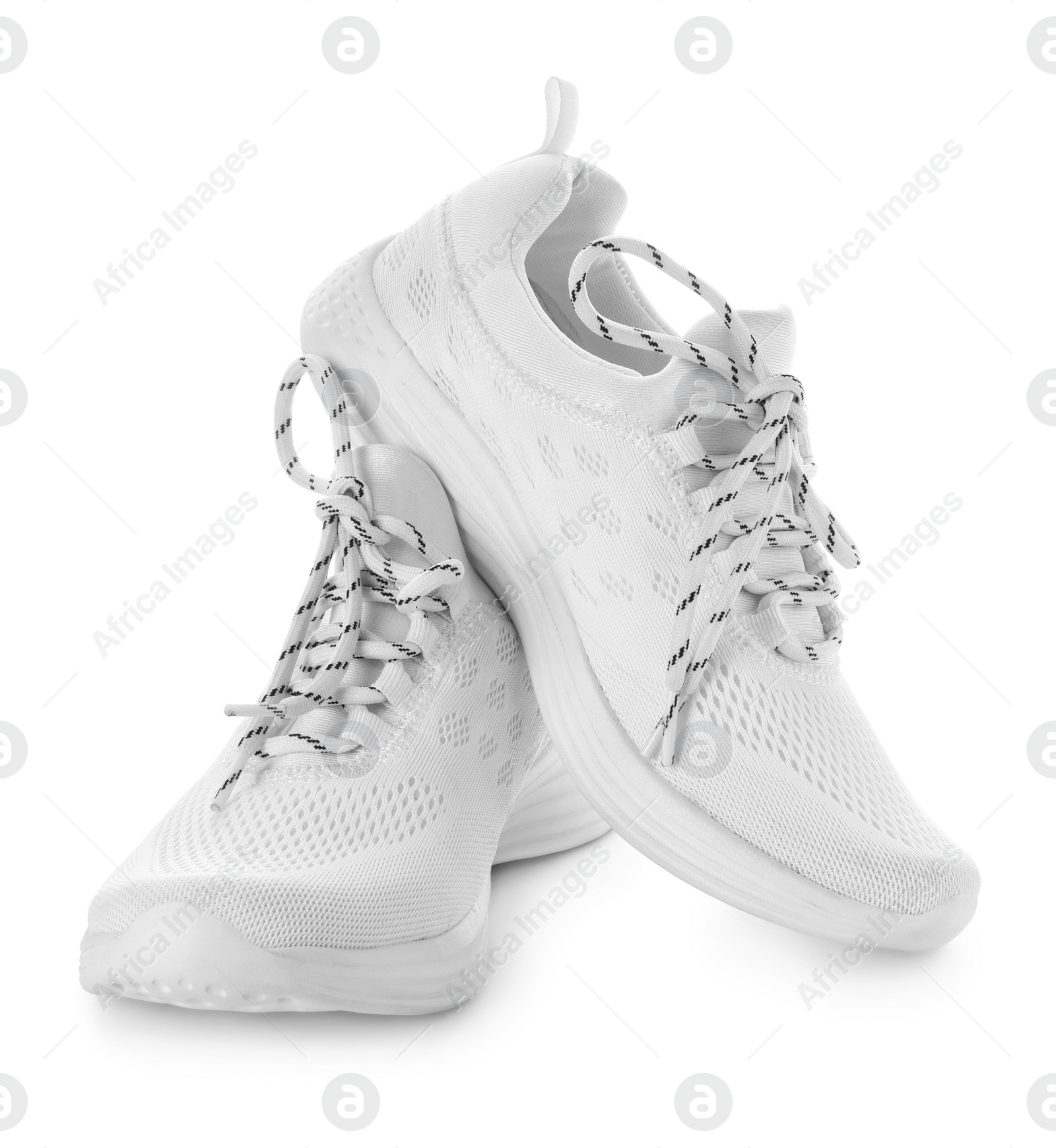 Photo of Stylish sneakers with shoelaces on white background