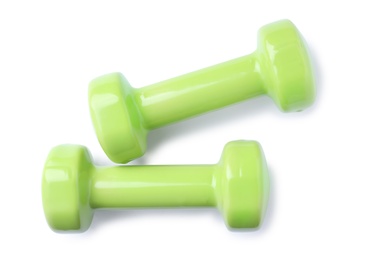 Photo of Color dumbbells on white background. Home fitness