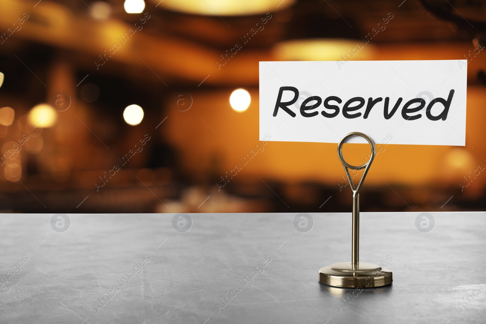 Image of Sign Reserved on grey table in restaurant, space for text