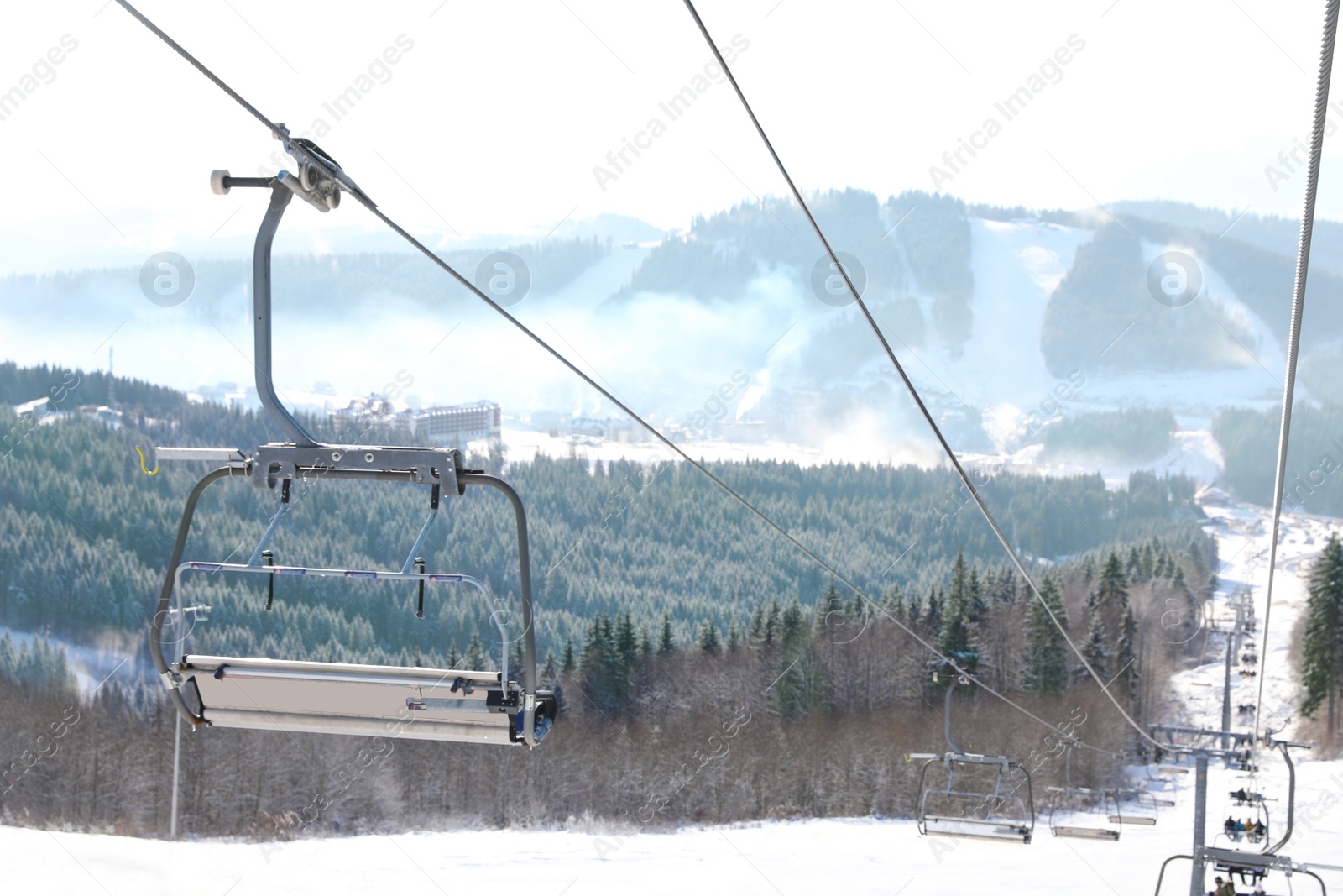 Photo of Beautiful mountain landscape with chairlift. Winter vacation