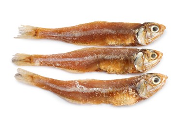 Delicious dried salted anchovies on white background, top view