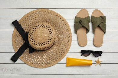 Photo of Flat lay composition with beach objects on white wooden background