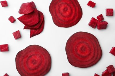 Photo of Cut fresh beet on light background, flat lay