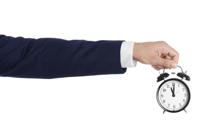 Photo of Young businessman holding clock on white background. Time management