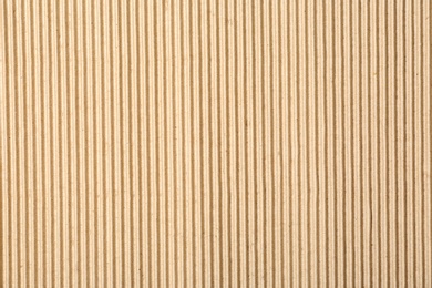 Corrugated cardboard surface as background, top view. Recyclable material