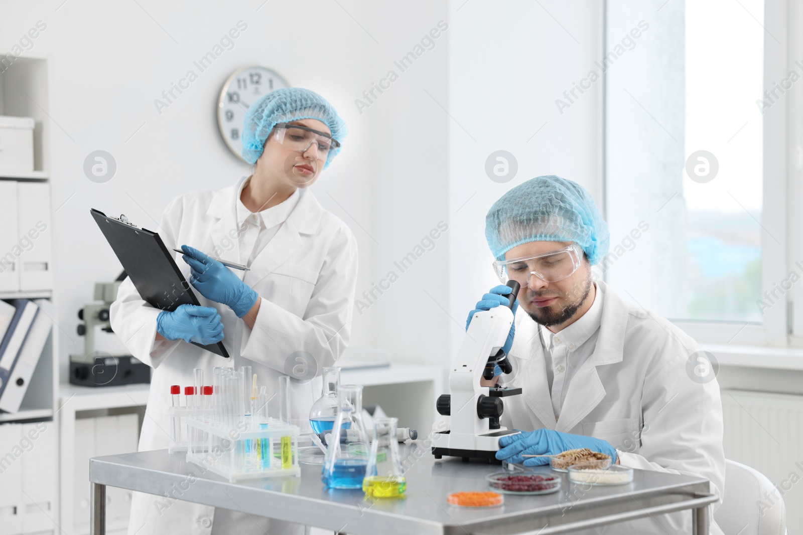 Photo of Quality control. Food inspectors checking safety of products in laboratory