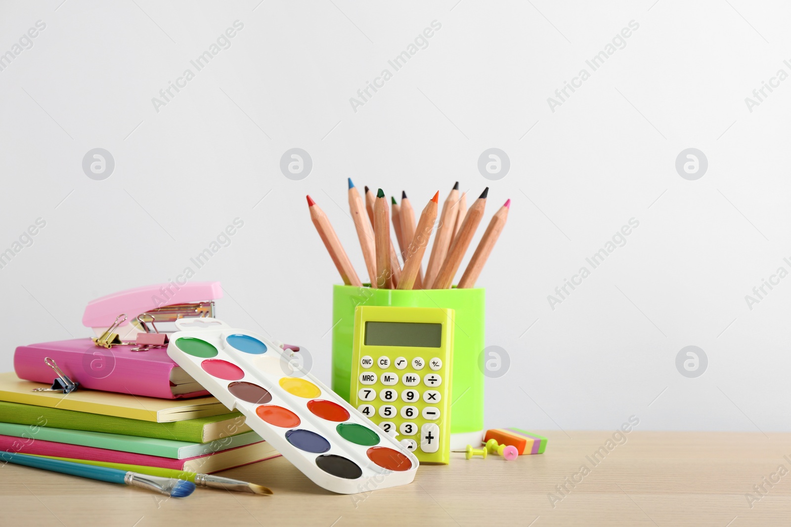 Photo of Different school stationery on table against white background, space for text. Back to school