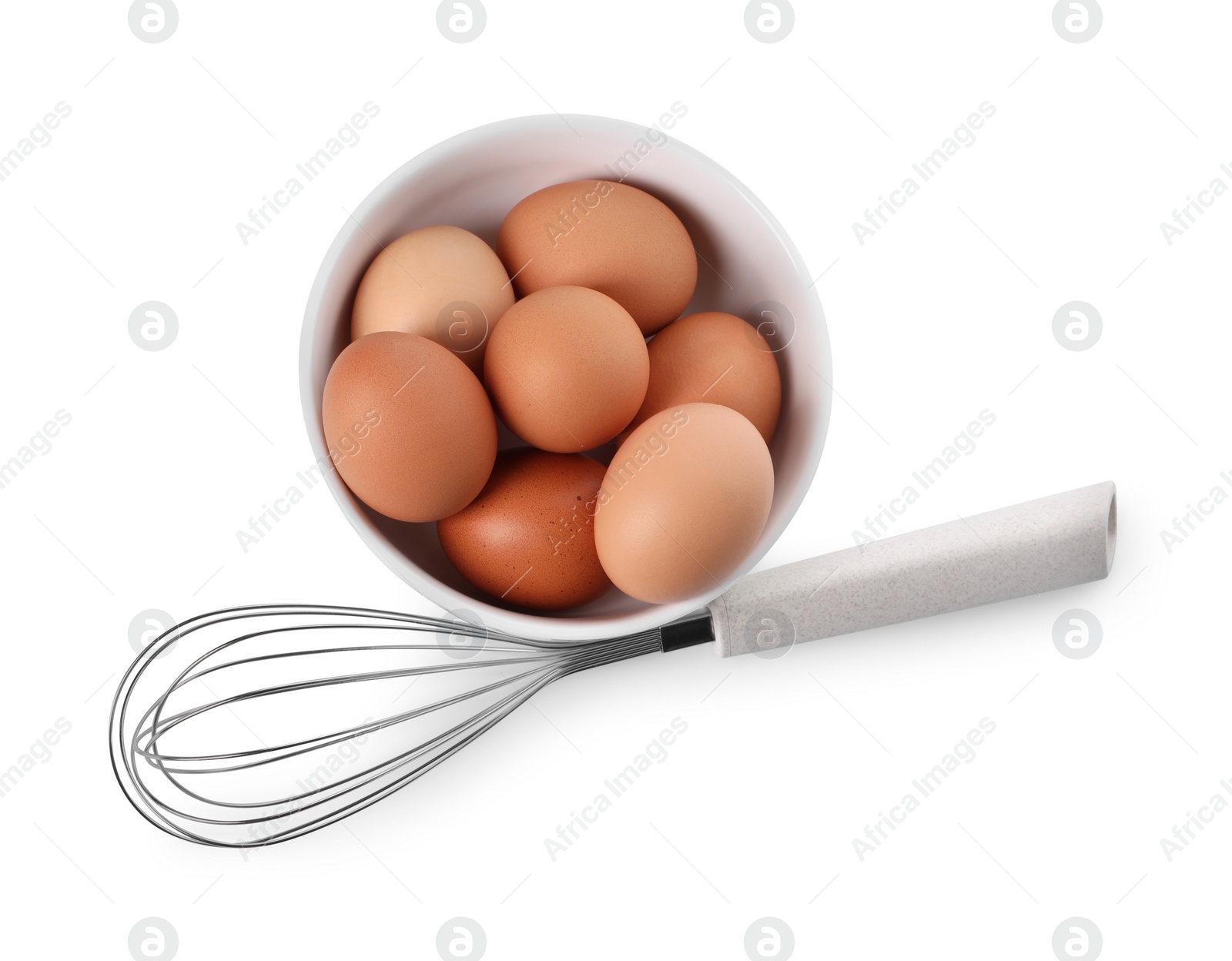 Photo of Whisk and bowl with raw eggs isolated on white, top view