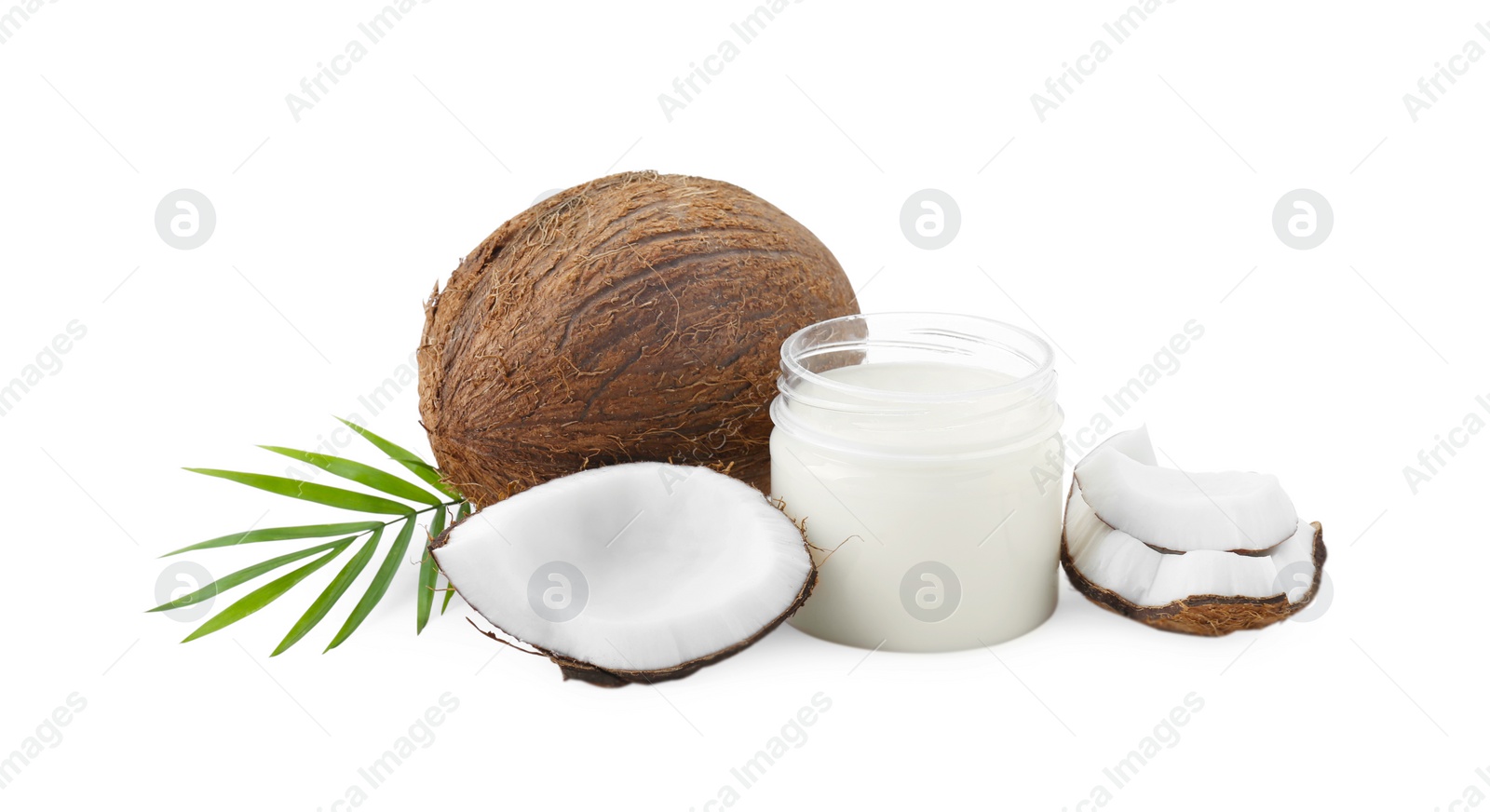 Photo of Organic coconut cooking oil, fresh fruits and leaf isolated on white