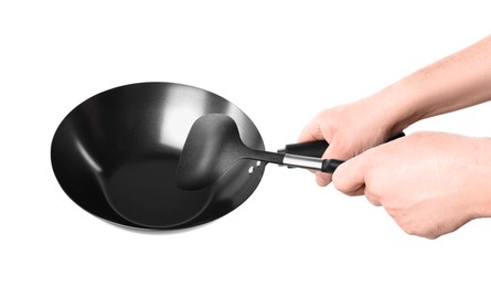 Photo of Man holding empty metal wok on white background, closeup