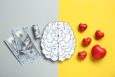 Photo of Emotional and rational. Paper human brain, dollar banknotes and red hearts on color background, flat lay