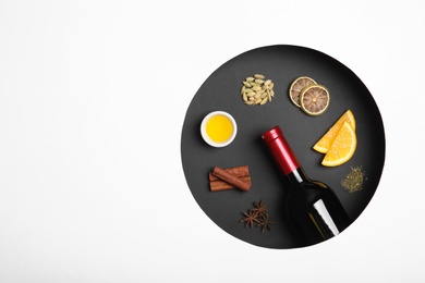 Photo of Composition with ingredients for mulled wine on white background, top view. Space for text