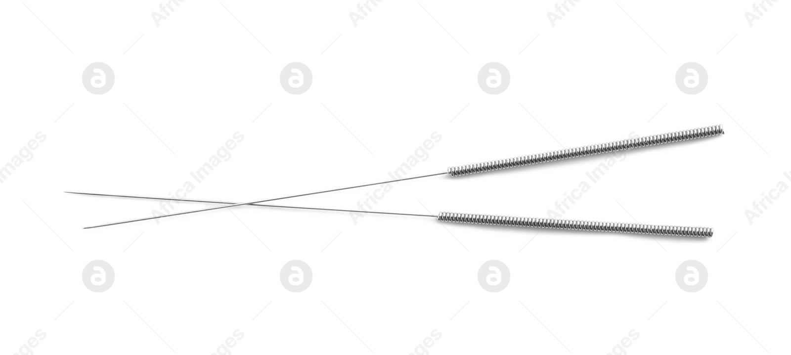 Photo of Needles for acupuncture on white background