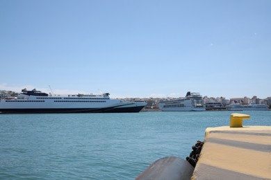 Photo of Modern cruise ship and ferry in sea port on sunny day