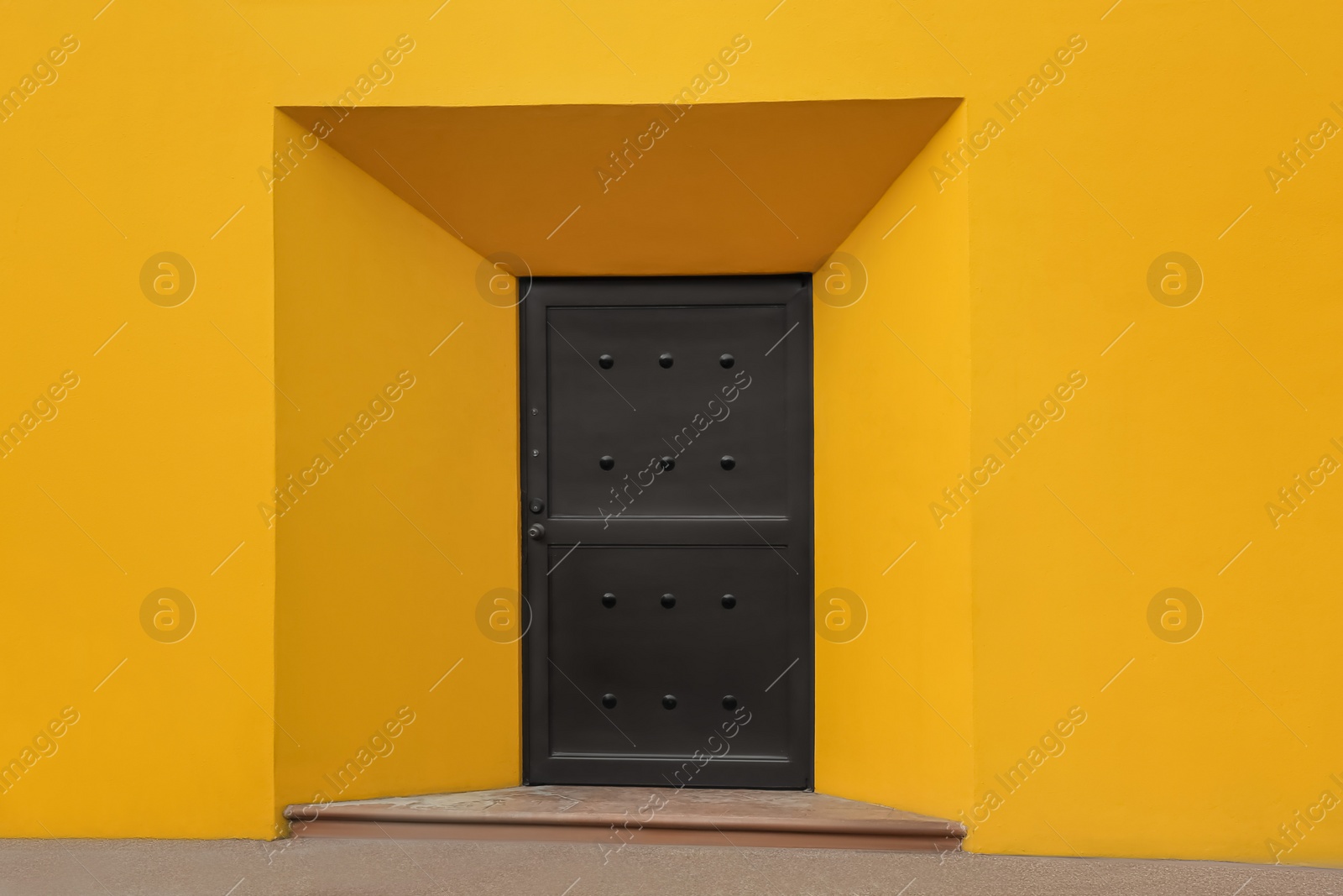 Photo of Entrance of house with beautiful brown metal door