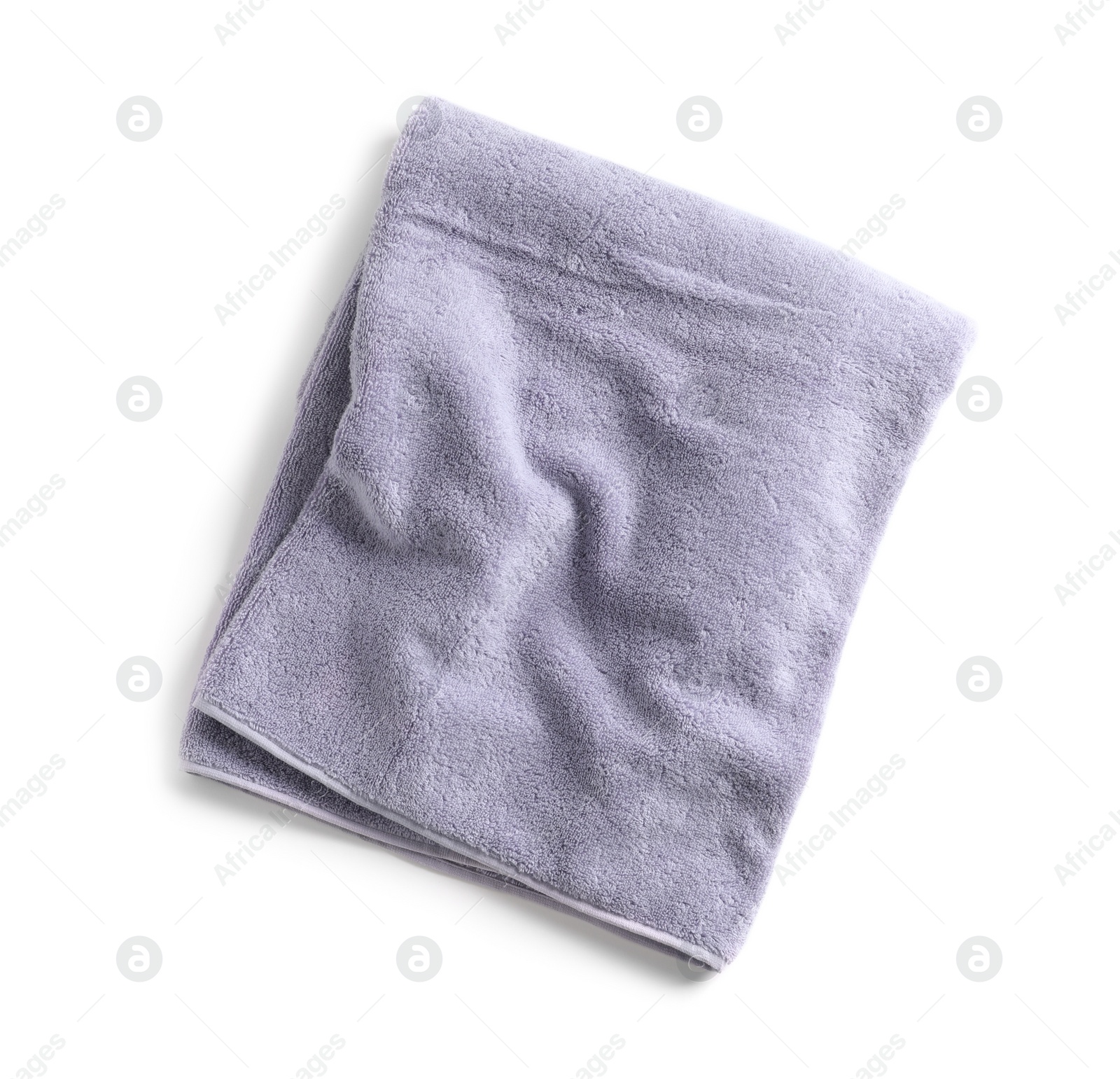 Photo of Soft folded towel isolated on white, top view