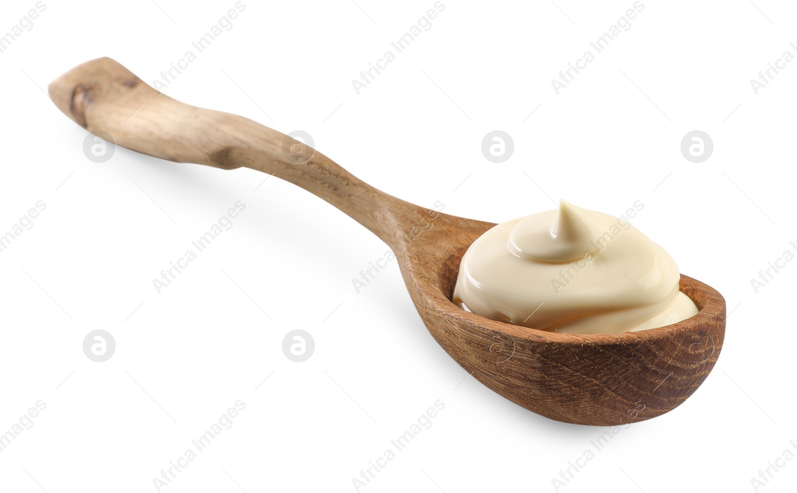 Photo of Natural yogurt in wooden spoon isolated on white