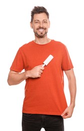 Photo of Handsome man using lint roller on white background