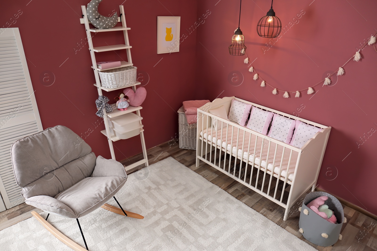 Photo of Cozy baby room interior with crib and rocking chair