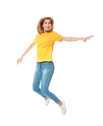 Photo of Full length portrait of happy beautiful woman jumping on white background