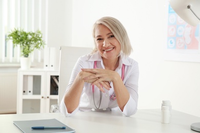 Photo of Doctor consulting patient using video chat in clinic, view from web camera