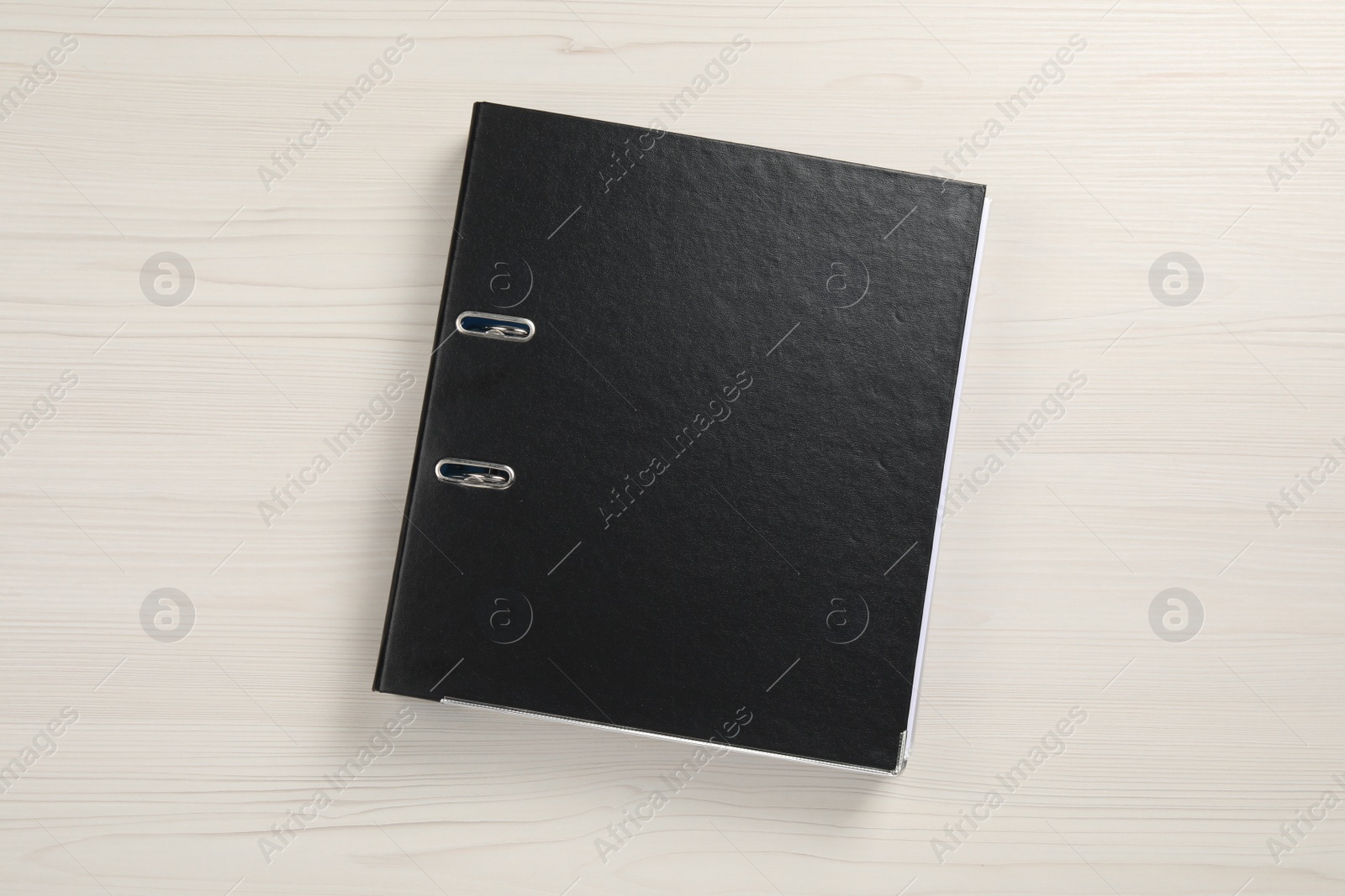 Photo of Office folder on white wooden table, top view