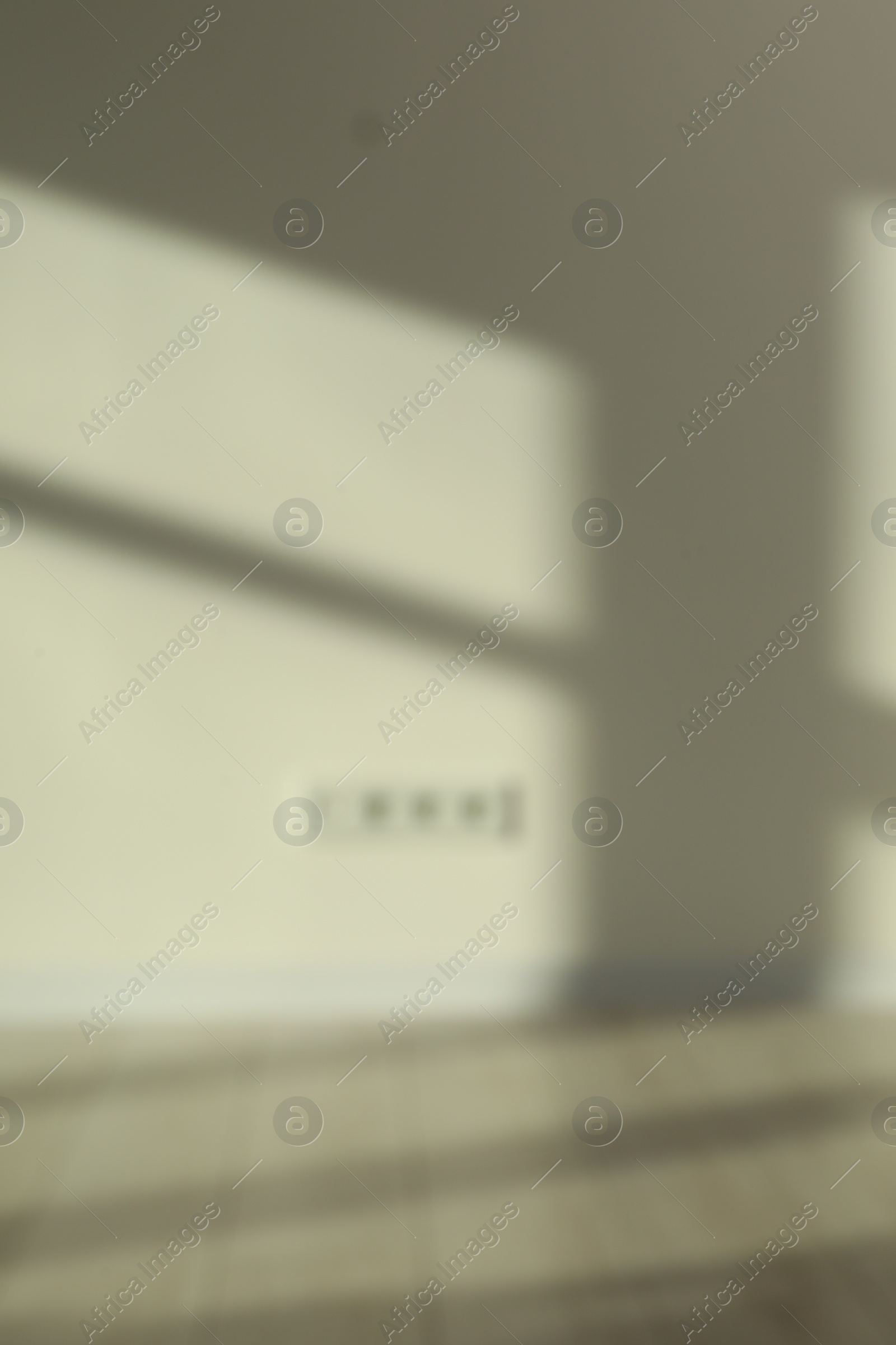 Photo of Blurred view of room with shadows on wall