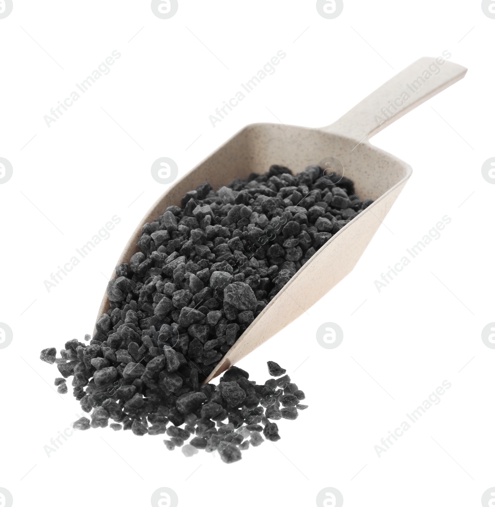Photo of Black salt in plastic scoop on white background