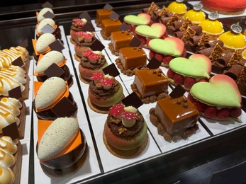 Photo of Showcase with different tasty desserts in store