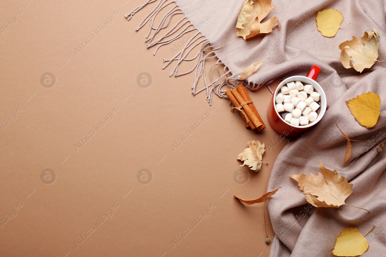 Photo of Flat lay composition with hot drink on beige background, space for text. Cozy autumn