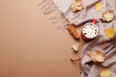Photo of Flat lay composition with hot drink on beige background, space for text. Cozy autumn