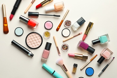 Photo of Flat lay composition with decorative cosmetics on color background